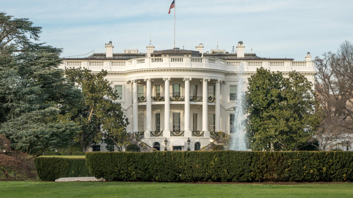 An exterior shot of the White House at daytime.