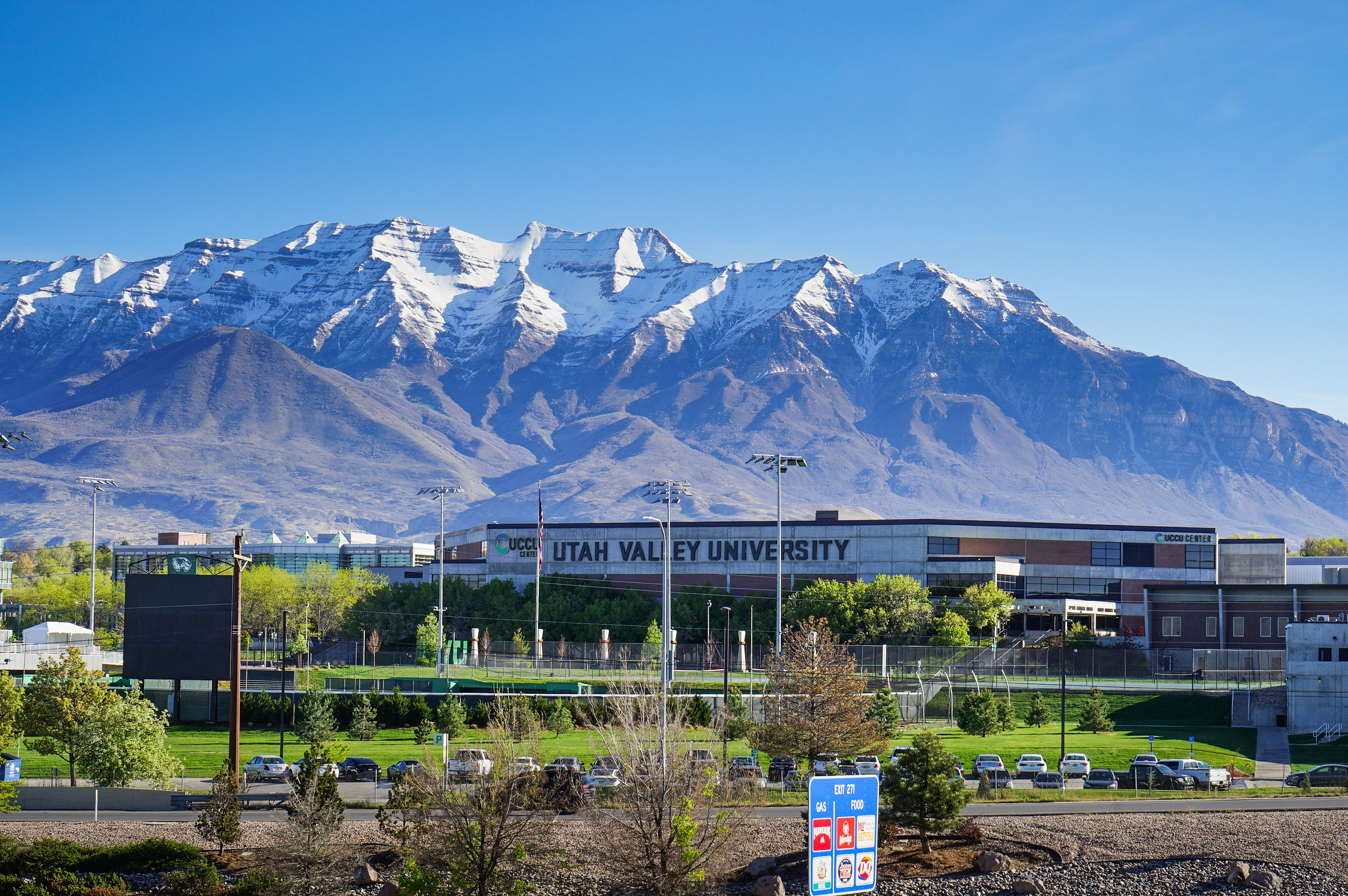 utahmeasles_02 An exterior shot of a Utah Valley University building with mountains seen behind it.