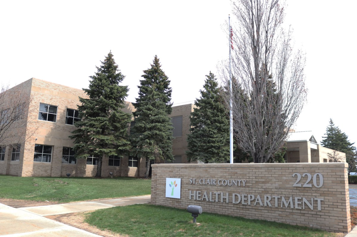 A photo of the exterior of an office building with a sign that reads "St. Clair County Health Department"